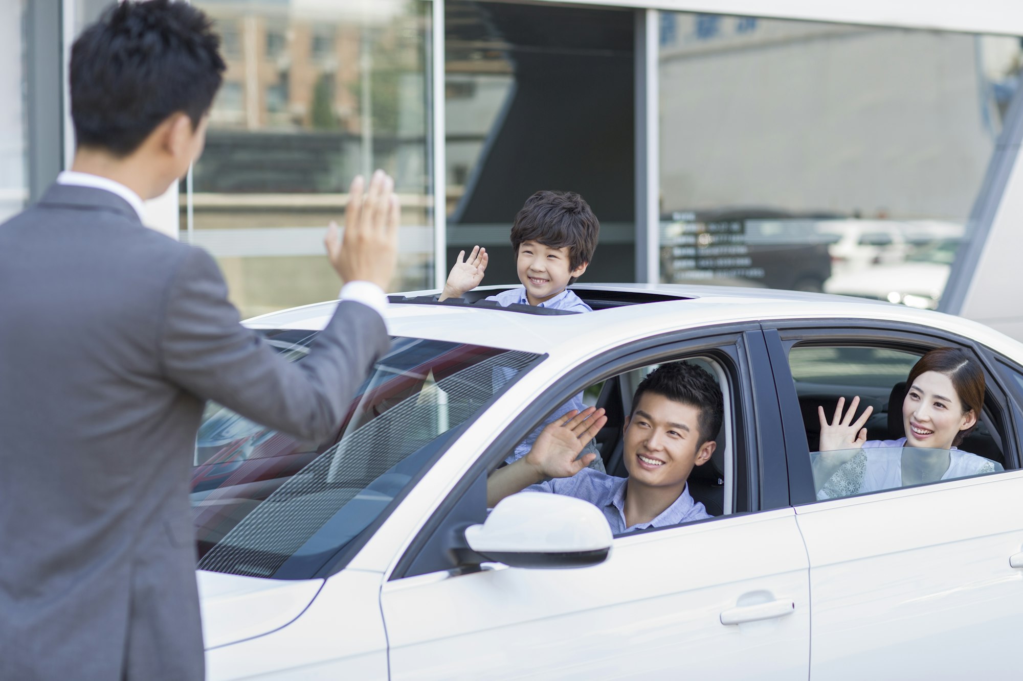 Young family buying car